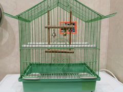 Клетка для птиц с игрушками